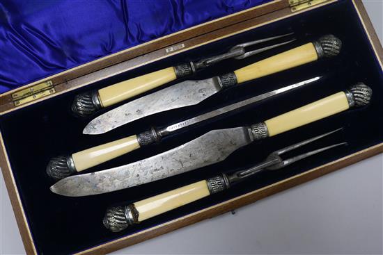 A Victorian five piece ivory handled carving set, cased